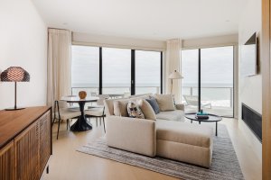 The living area in the Ocean View One Bedroom Residence at Gurney's Montauk Resort