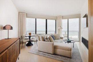 The living area in the Ocean View One Bedroom Residence at Gurney's Montauk Resort
