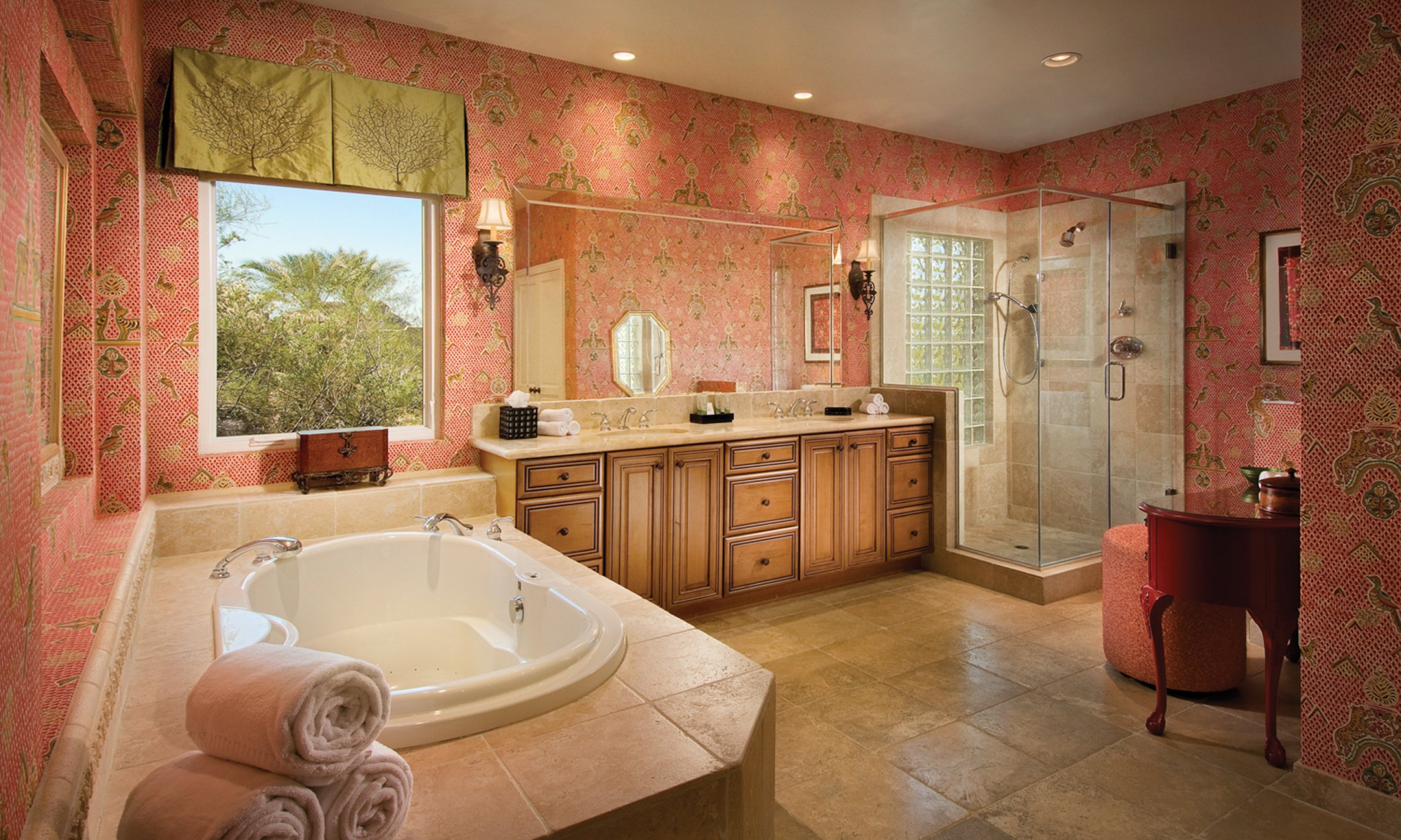Bathroom with soaking tub, walk-in shower, two sinks and vanity.