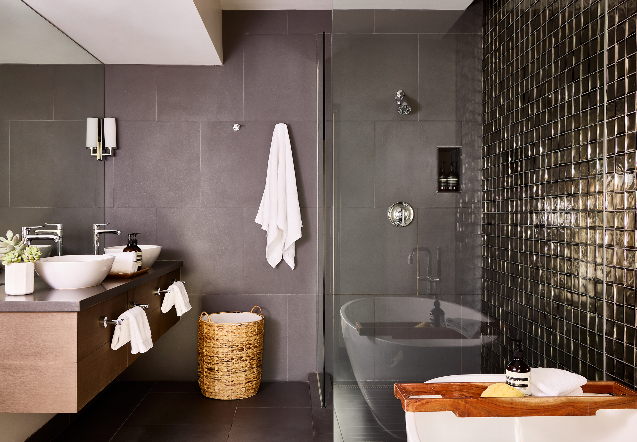 Bathroom with soaking tub, walk-in shower, two sinks and vanity.