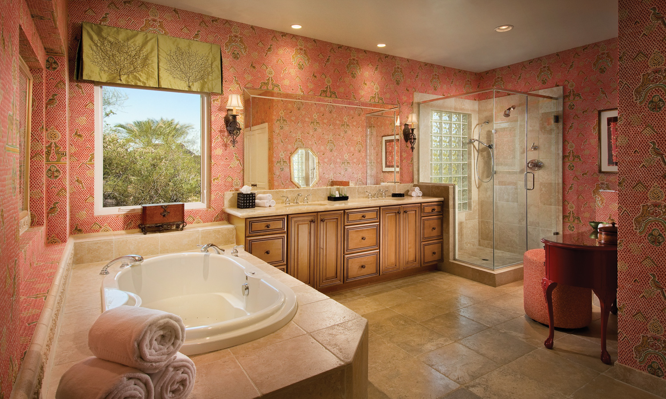 Bathroom with soaking tub, walk-in shower, two sinks and vanity.