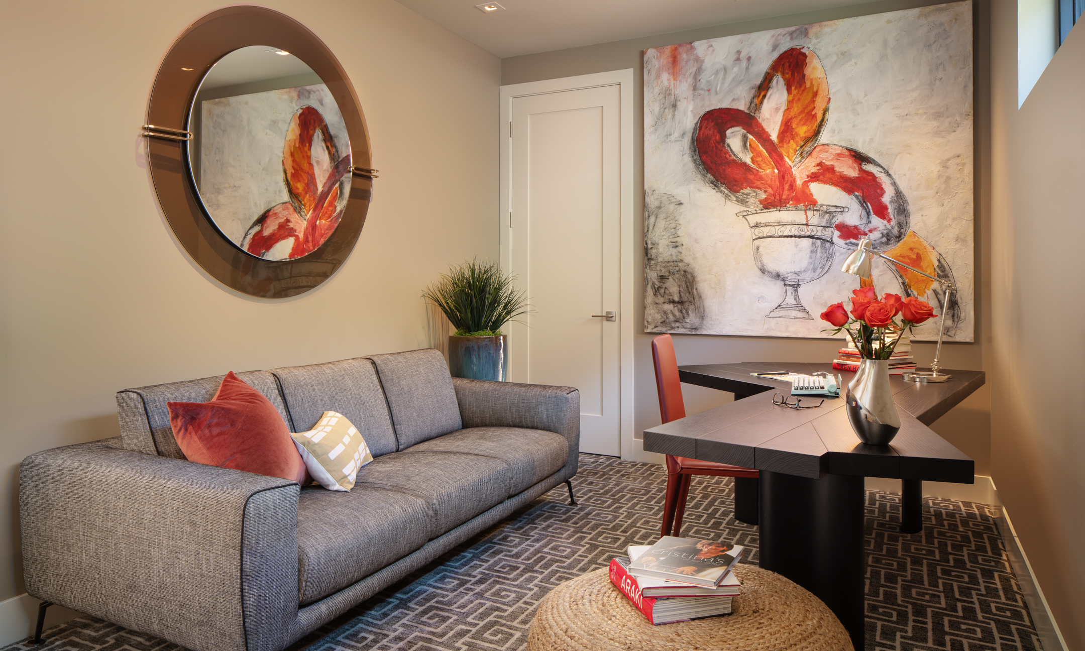 Sitting room with couch, writing table and chair.