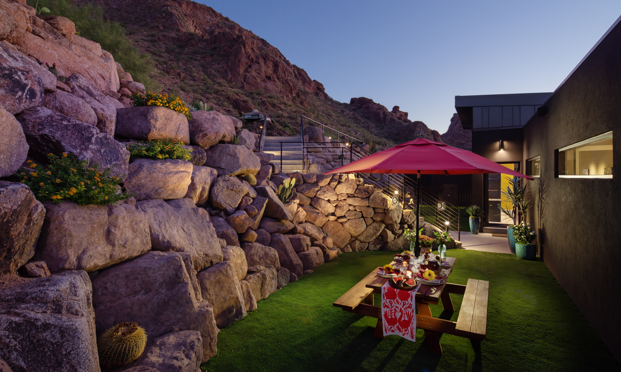 Courtyard with wooden picnic bench and view of Camelback Mountain.