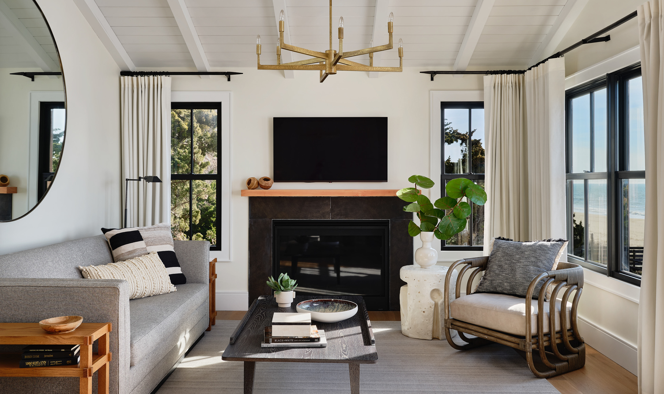 Living room with couch, chair, coffee table and television.