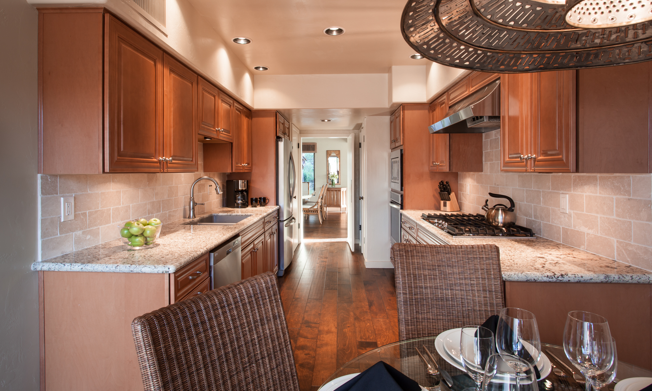 Villa Norte kitchen with stove, coffee pot and dining table.