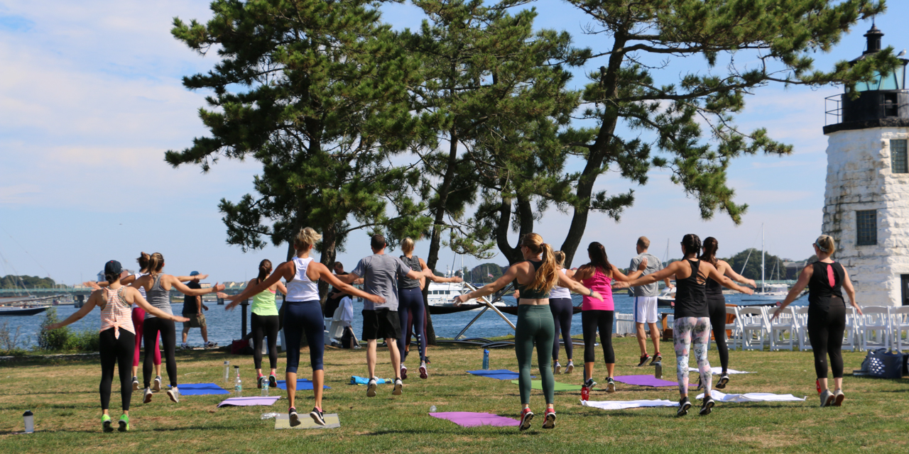 Outdoor fitness class on Gurney's Newport lawn.