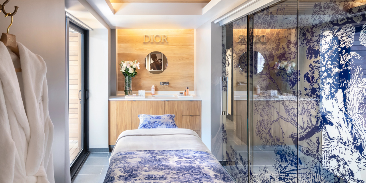Dior Treatment room with Dior floral print beddings and artwork.