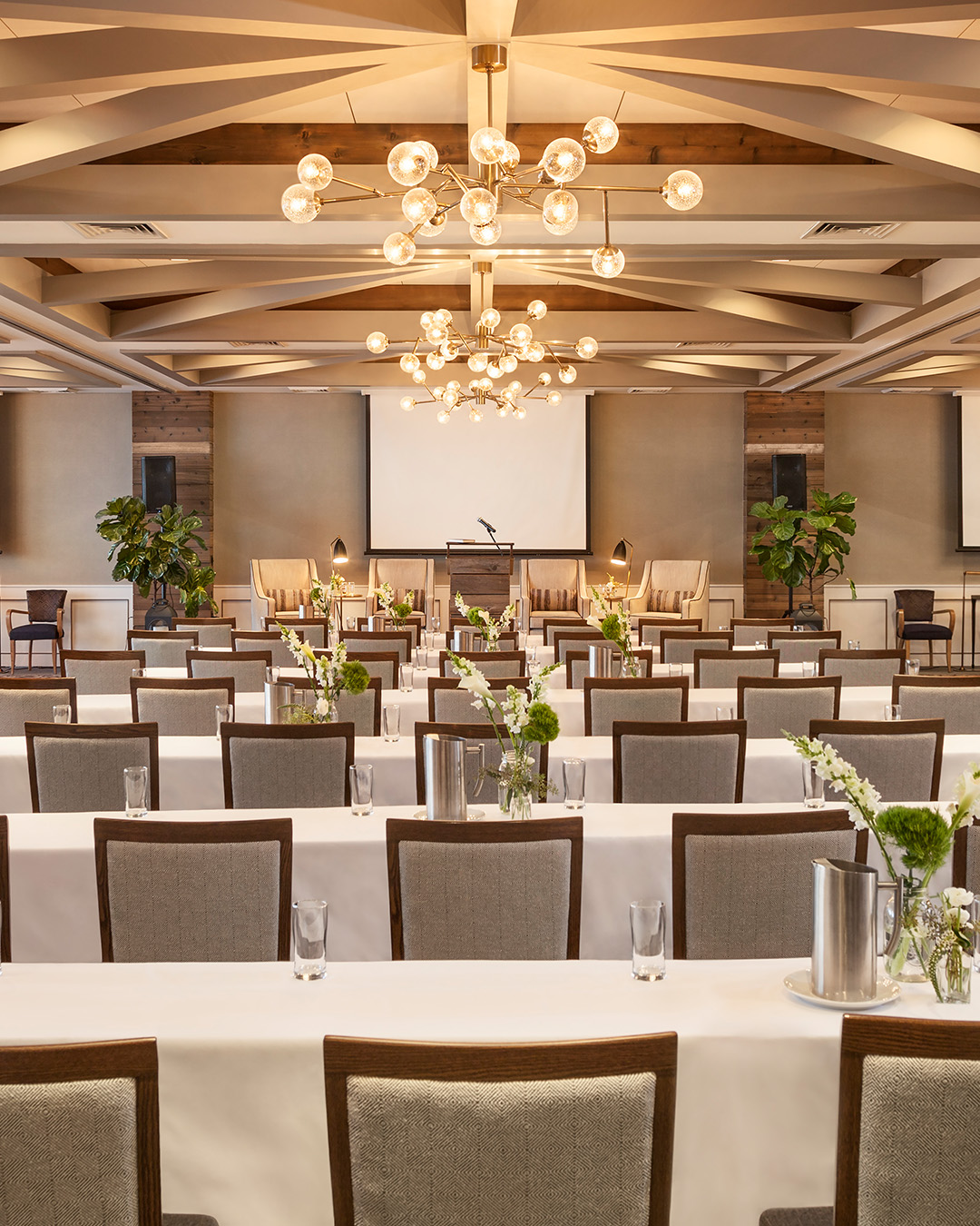 Chairs aligned in a theater setup with a view of the ocean in the background at Gurney's Montauk Resort