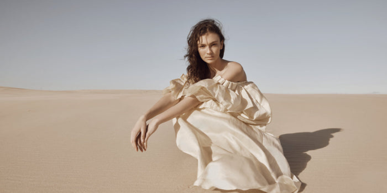 A woman wearing Cadre | Style Clothing on the desert sand