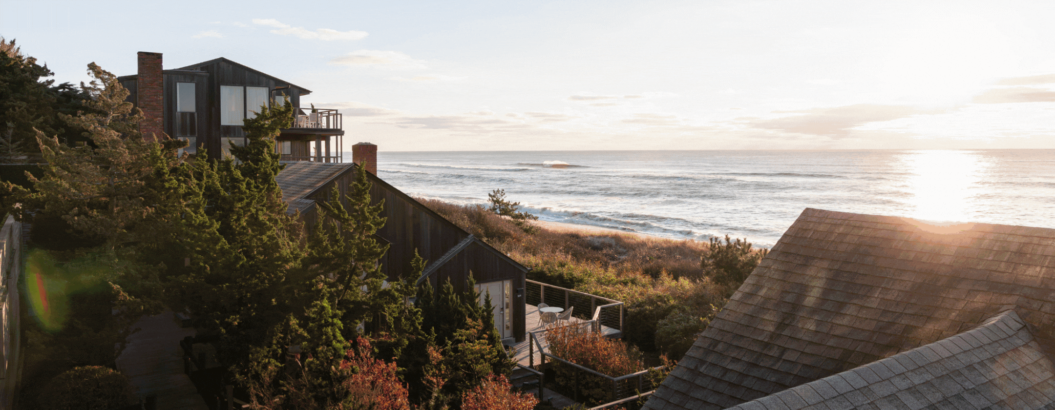 Sunrise over the ocean at Gurney's Montauk Resort; a woman in a yoga pose outdoors