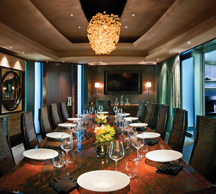 Table XII set for a private dinner with display kitchen view.