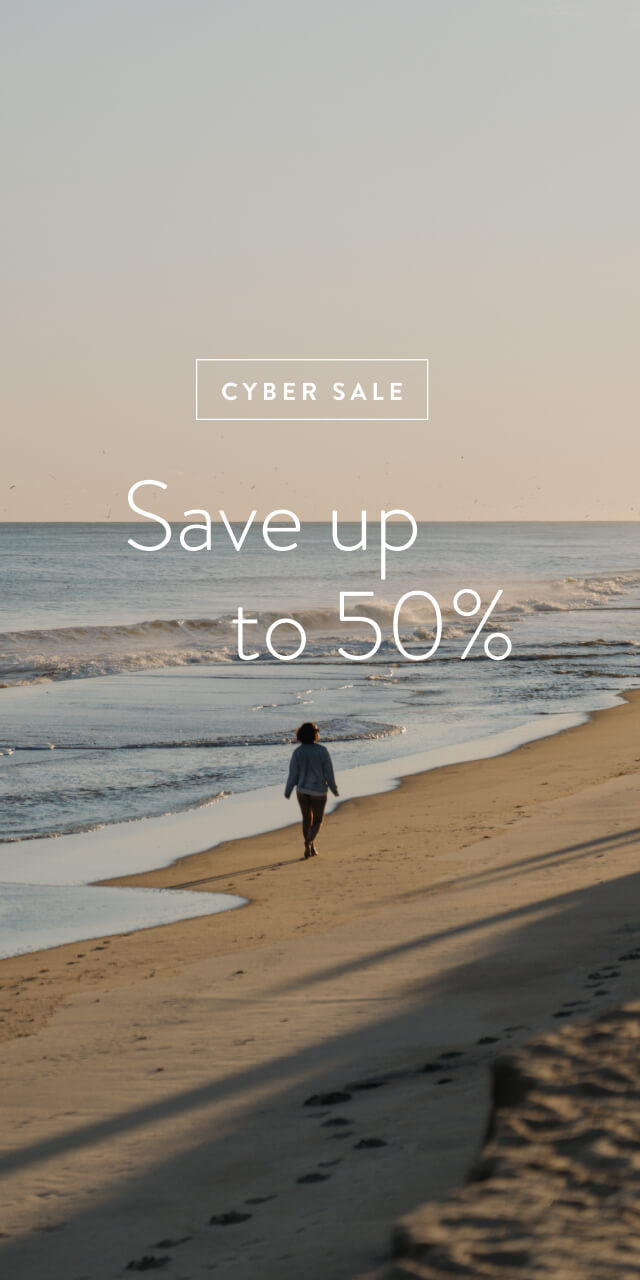 Picture of man walking on beach and the copy save up to 50% overlay