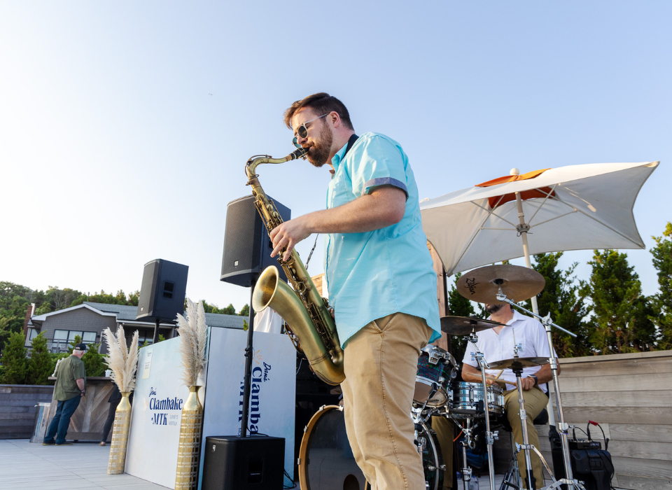 A man with a saxophone plays at an event at Gurney's Montauk