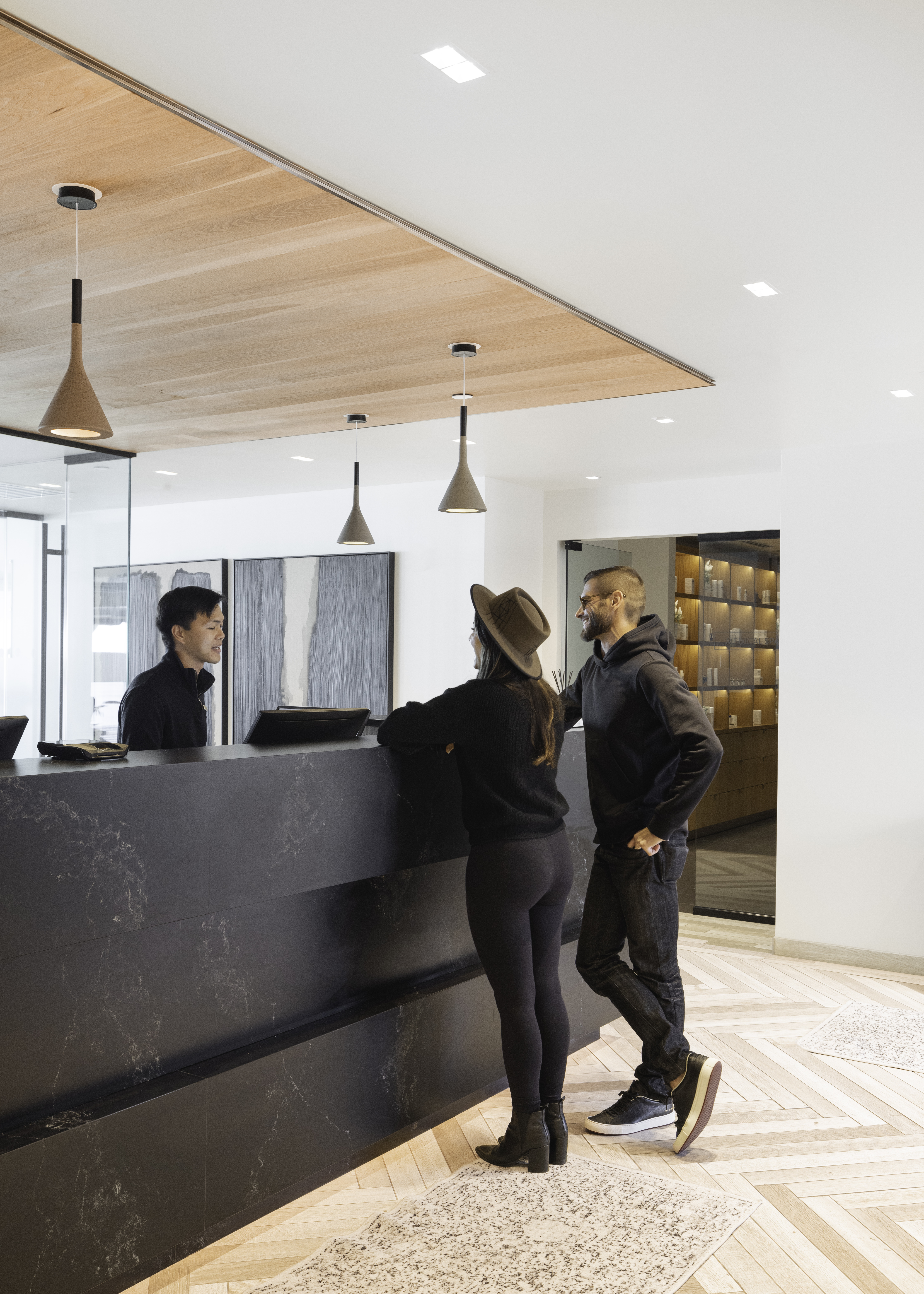 A couple happily checking in at Seawater Spa's front desk.