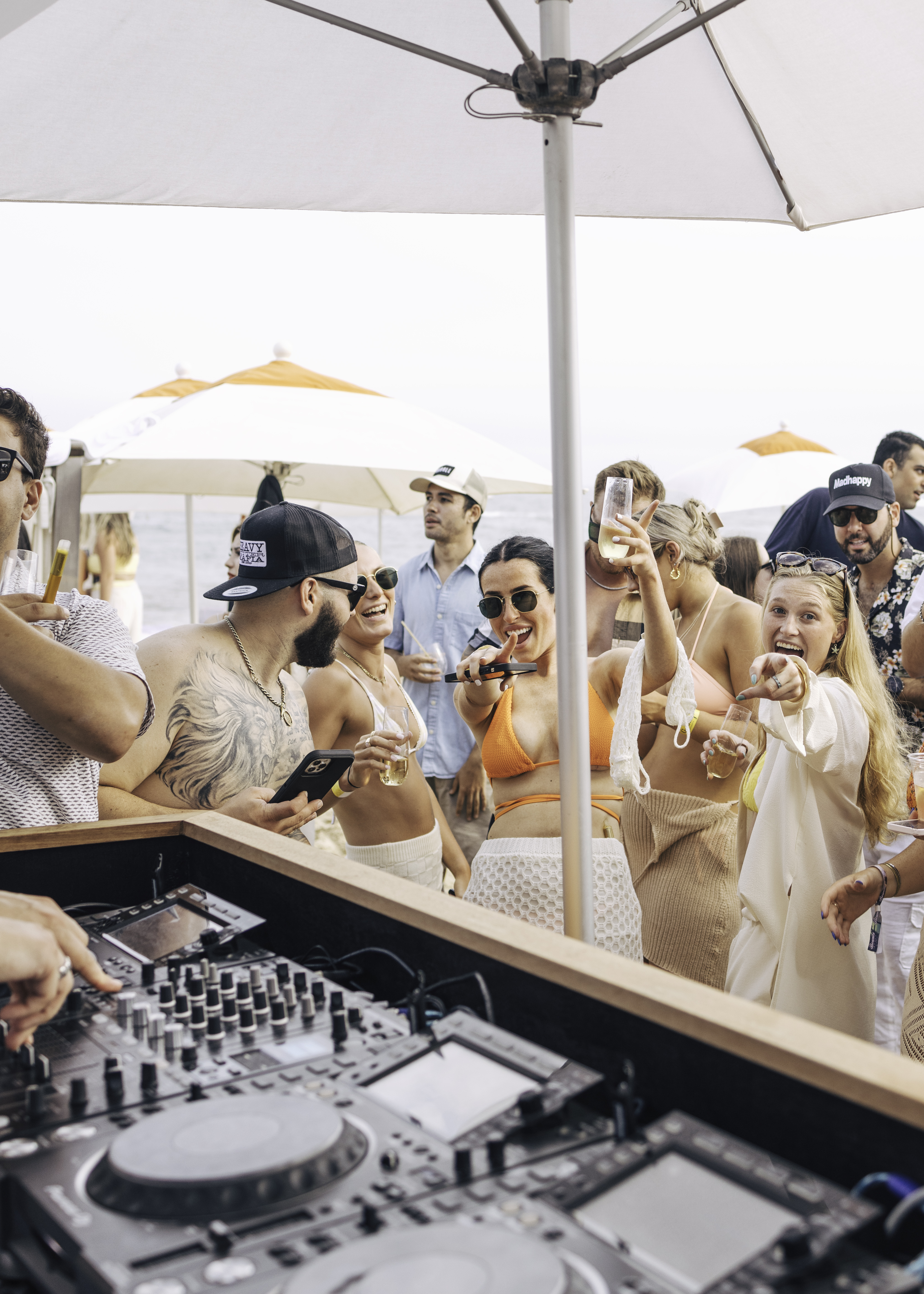 People dancing and enjoying dj music at the Beach Club.