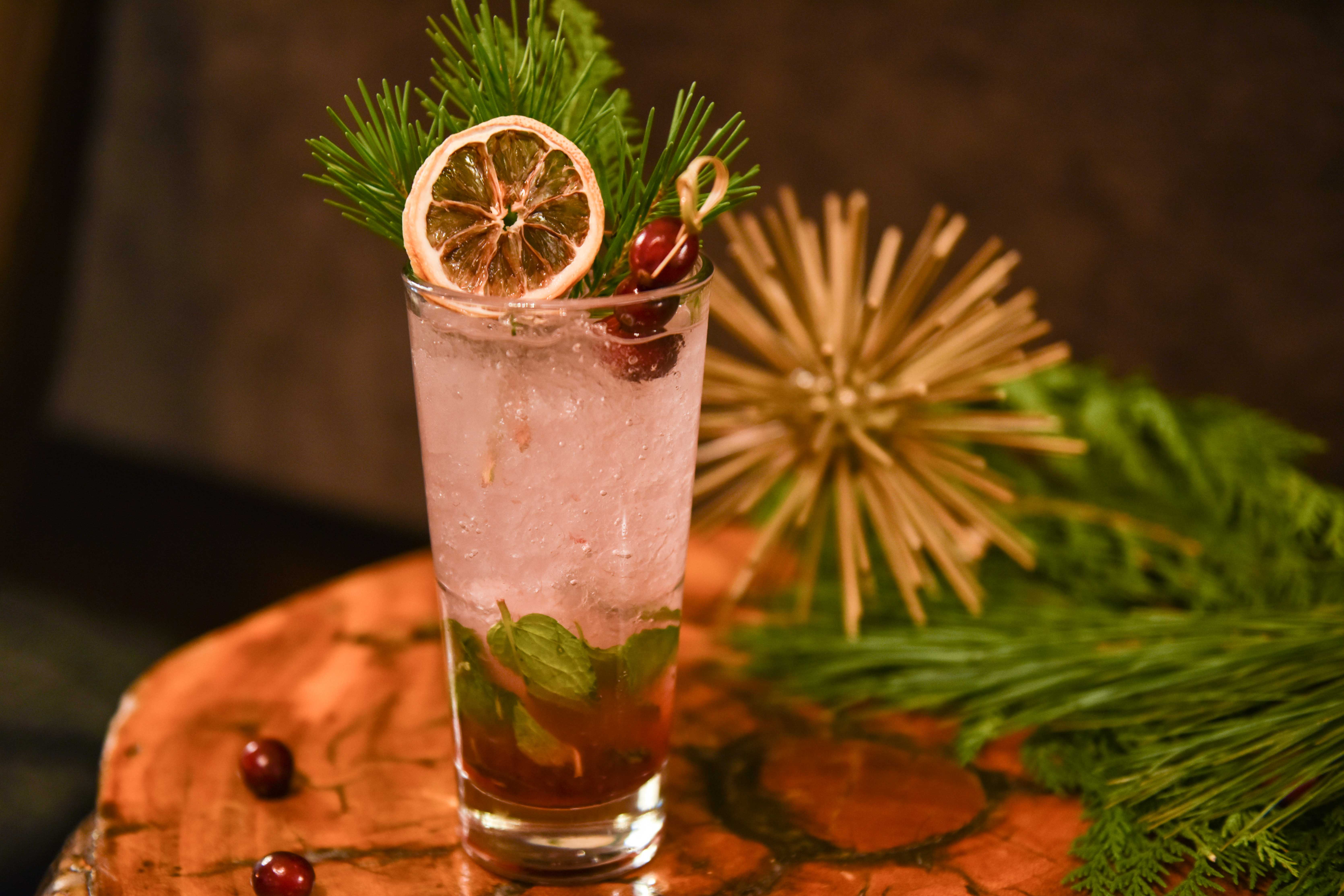 Three French Hens White Rum & Limoncello with cranberry, fresh mint and sage.
