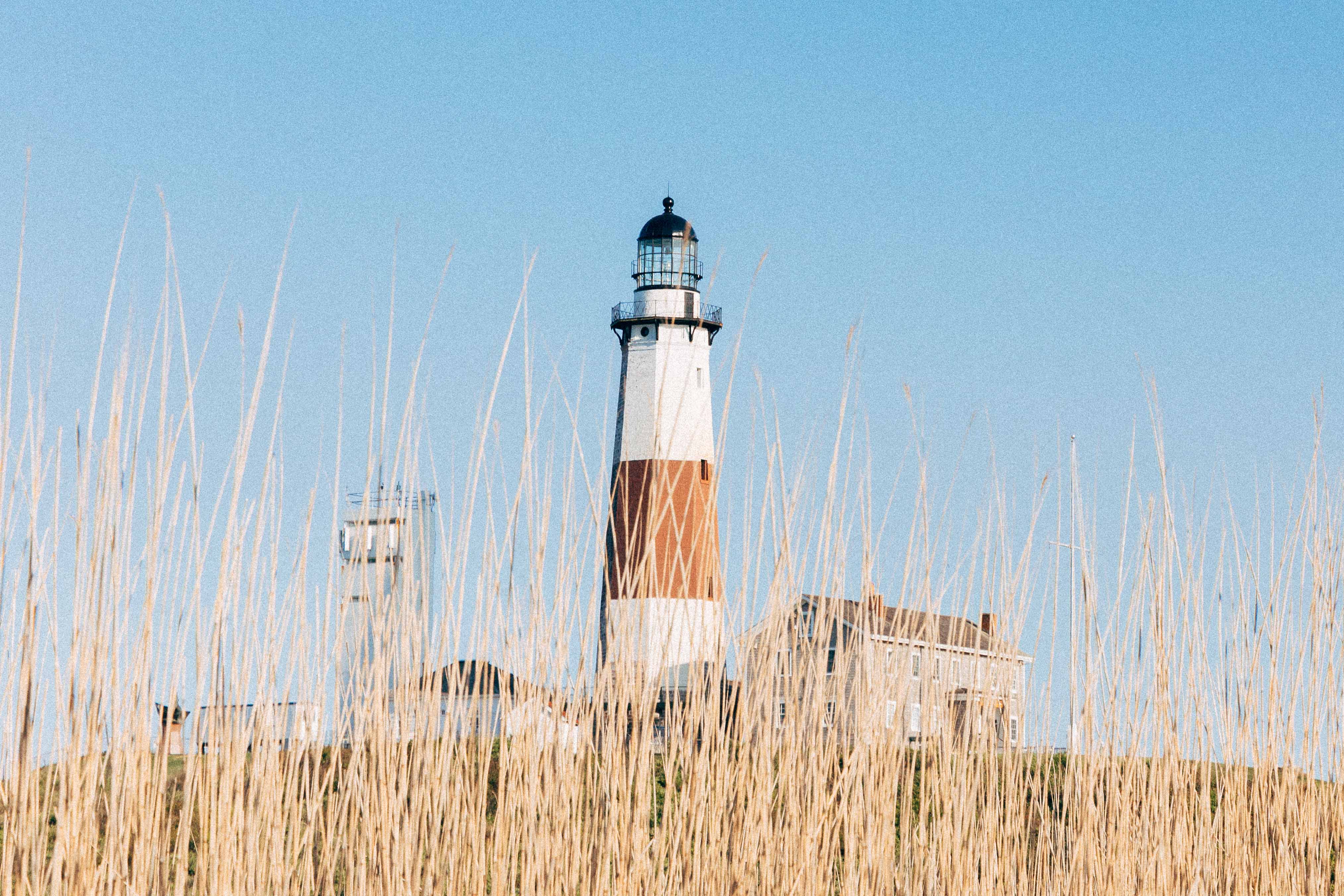 View of Montauk Lighthouse from across a field. 