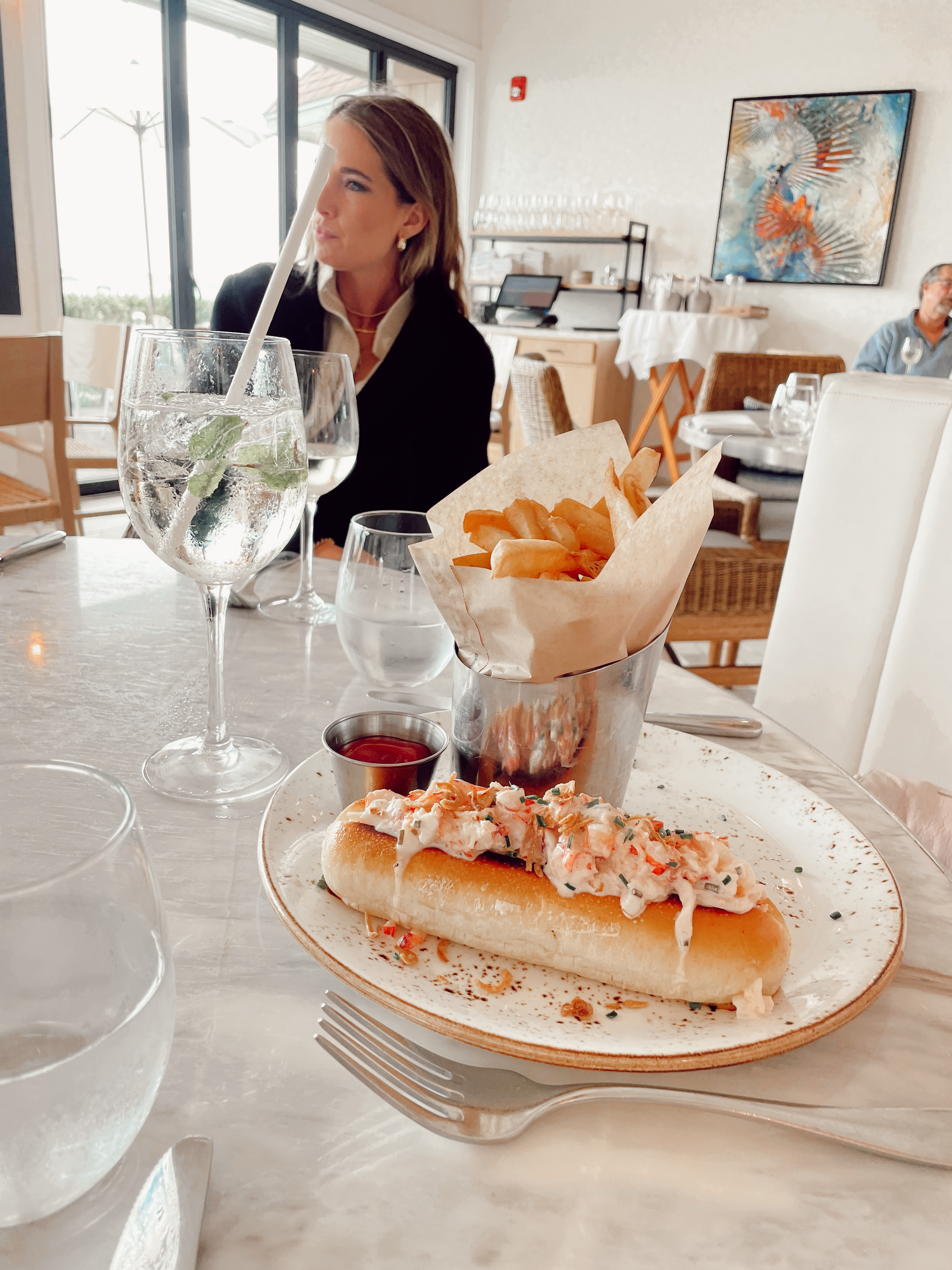 Woman enjoying a meal at Scarpetta.