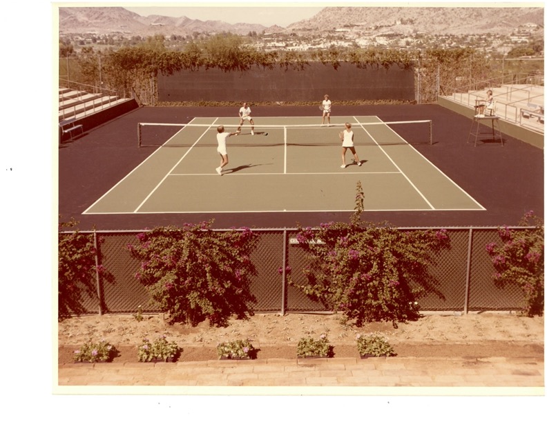 Historical photo of a group playing doubles at the Tennis Ranch.