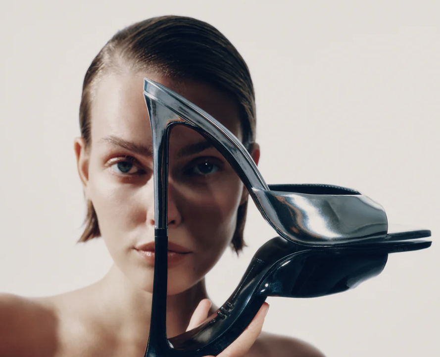 Girl holding a shoe