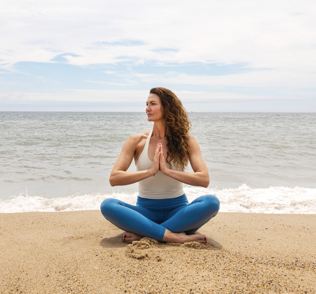 Kat Ruiz doing Yoga on the beach