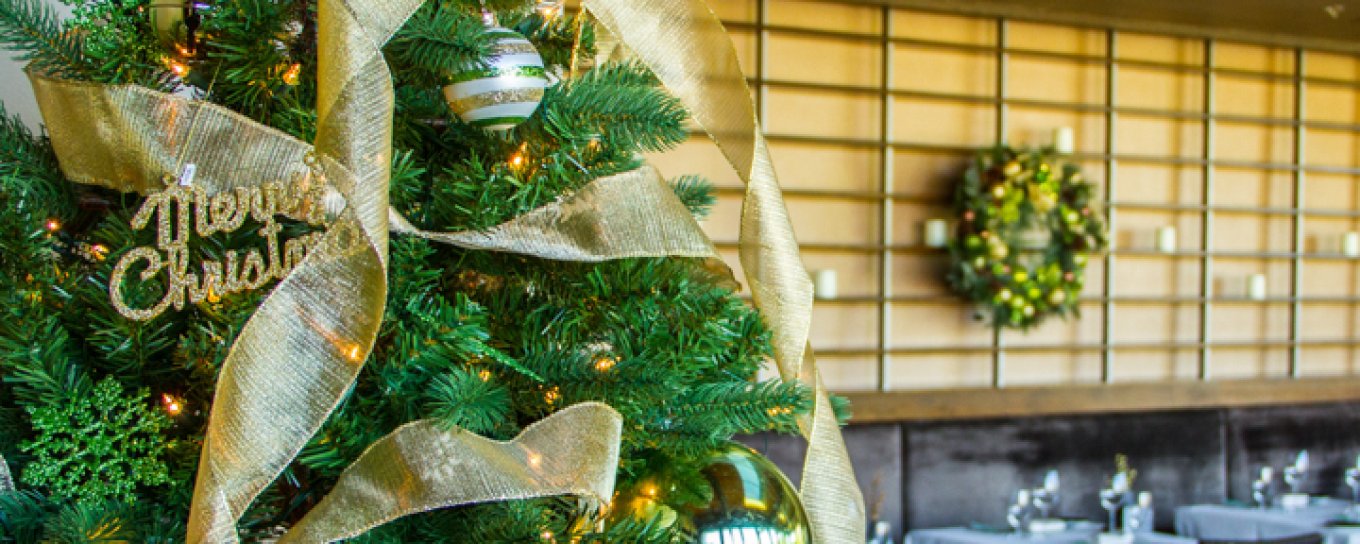 Praying Monk Dining Room decorated with Christmas tree, reefs and other holiday decor. 