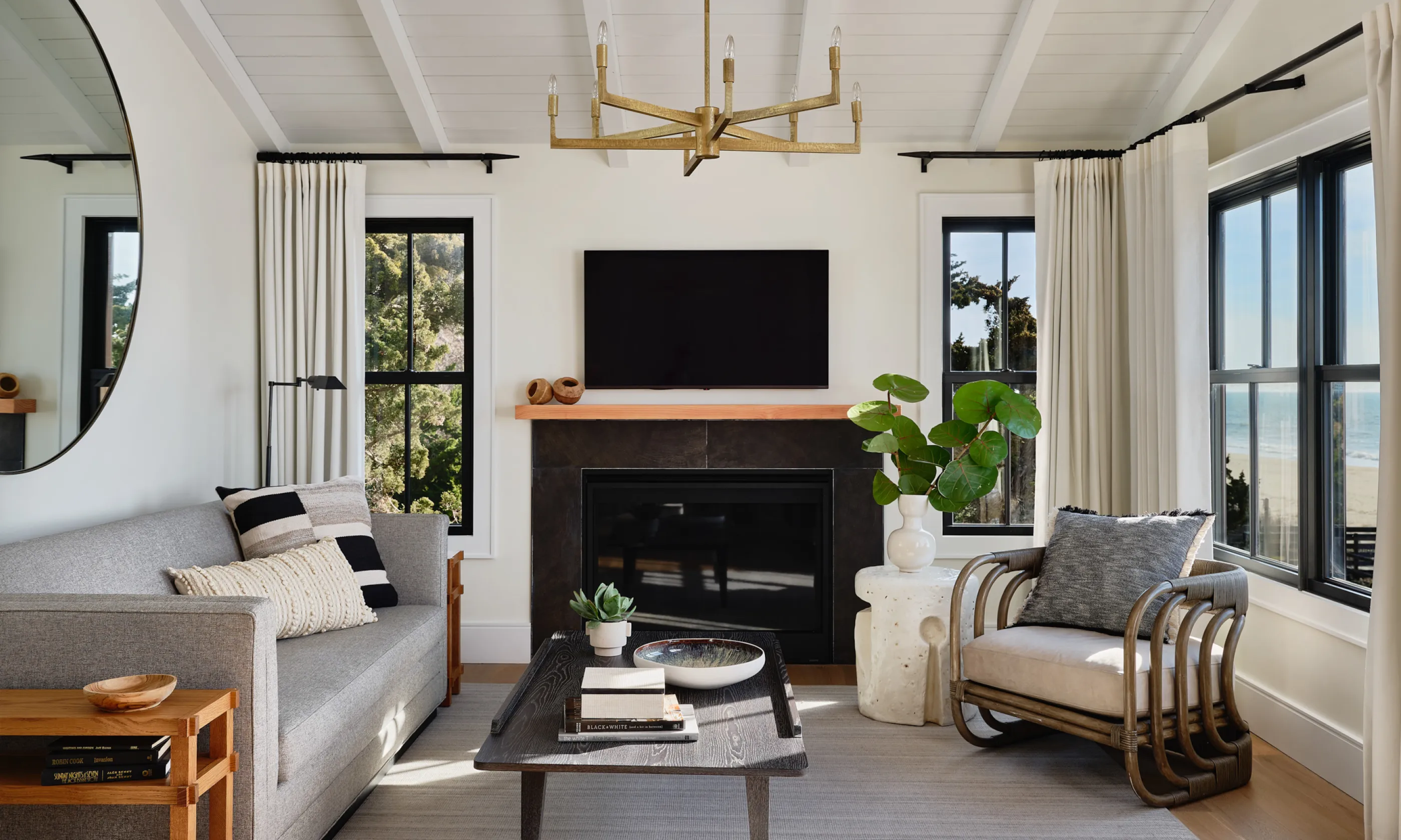 Living room with couch, chair, coffee table and television.