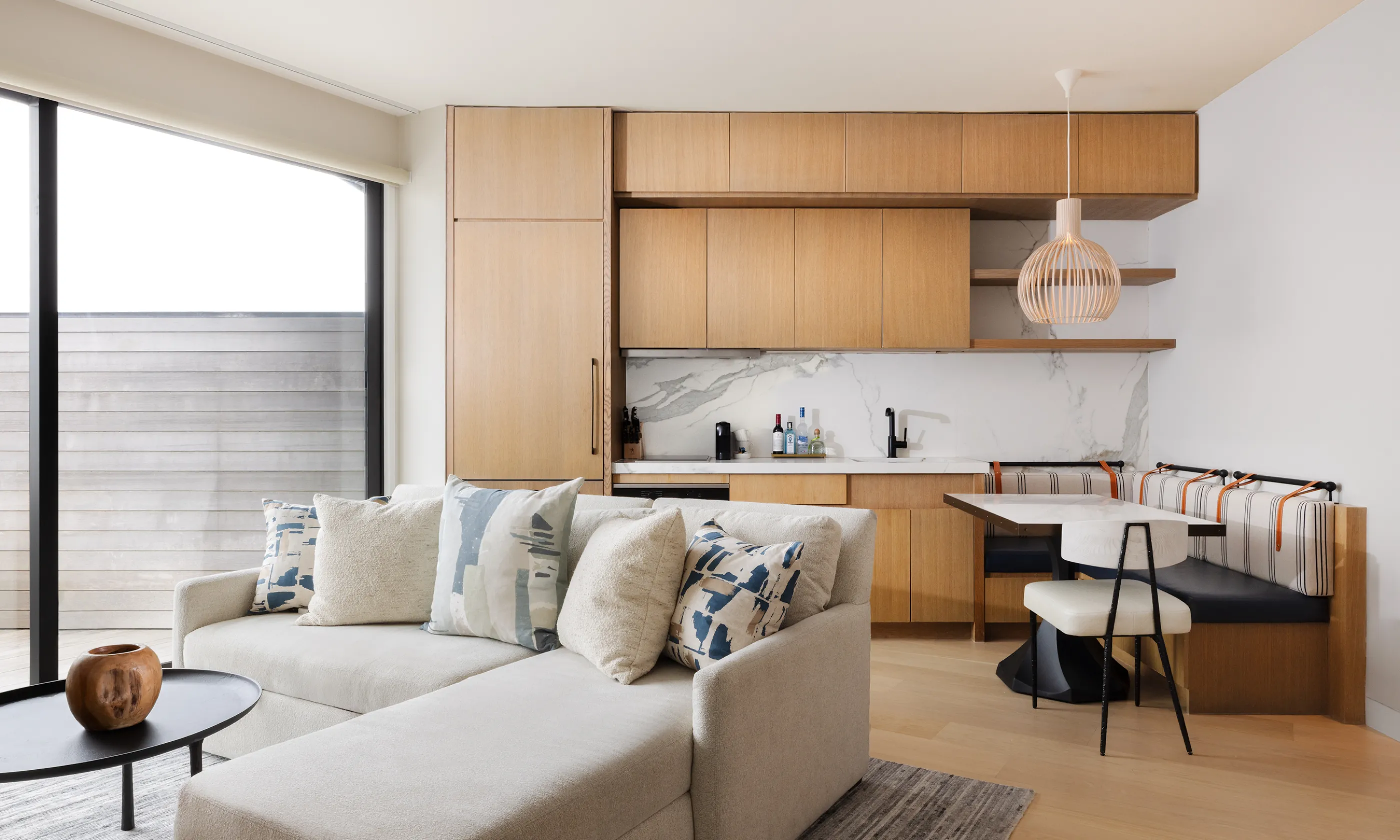 The living area and kitchen in the Ocean View Two Bedroom Residence at Gurney's Montauk Resort