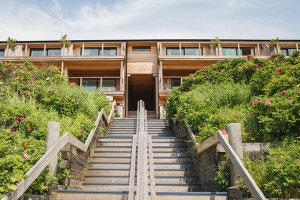 A wooden stairway facing upward to Gurney's Montauk Resort