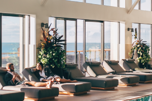A couple in robes relaxes beside the Seawater Spa pool at Gurney's Montauk