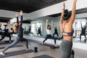 Women in yoga poses during an instructor-led class at Gurney's Montauk Resort