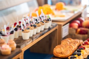 A buffet setup including parfaits and pastries