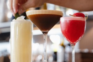 Various cocktails being garnished