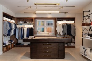 Retail Store full view. Center island with clothing around. 