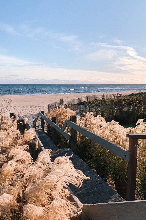 A boardwalk leading to the beach is framed by winter grasses at Gurney's Montauk Resort