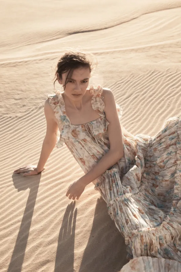 A woman wearing Cadre | Style Clothing on the desert sand