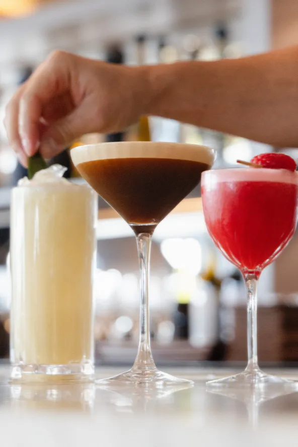 Various cocktails being garnished
