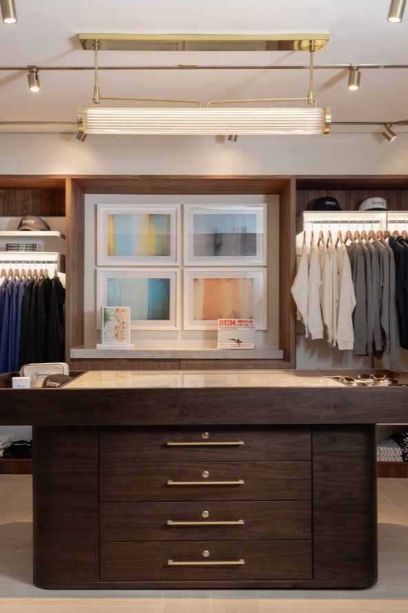 Retail Store full view. Center island with clothing around. 