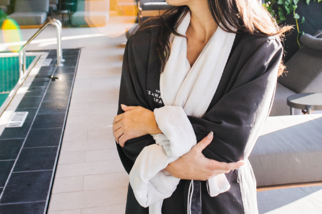 A close-up of a woman in a robe at The Seawater Spa