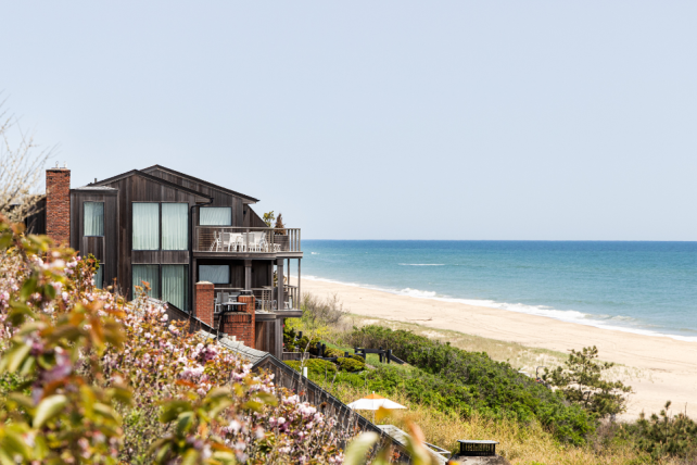 Flowers in the foreground and Gurney's Montauk Resort and beach in the background