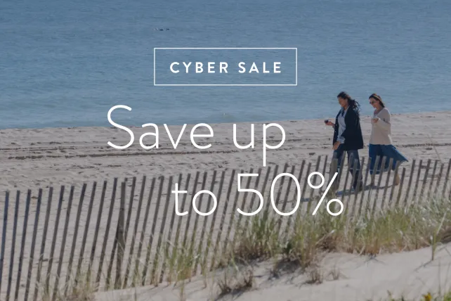 save up to 50% text over a beach walk image