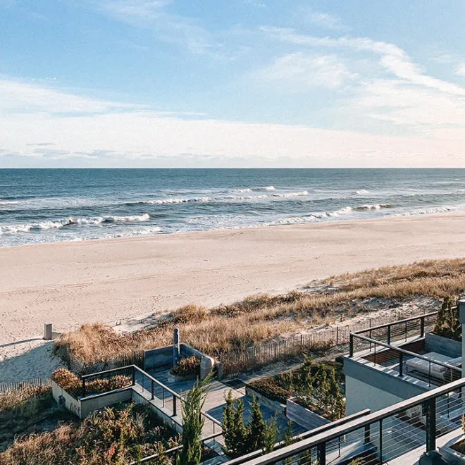 Ocean and beach viewed from a deck on the property