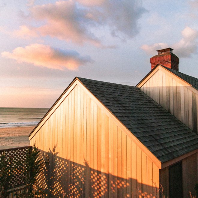 Sunrise over a wood sided building