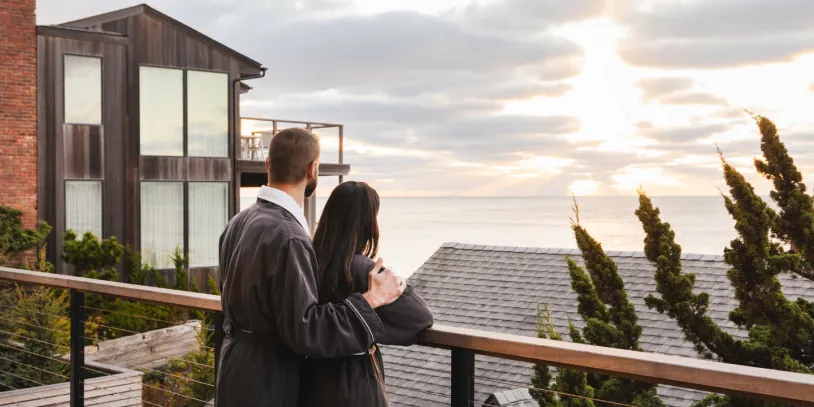 A couple in robes overlooks the view at Gurney's Montauk Resort