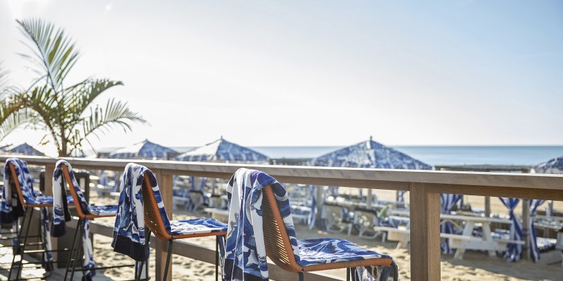 beach chairs with blue and white towels