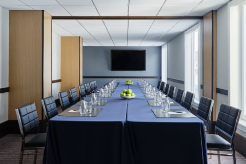 Newport meeting setup with rectangular table and chairs.