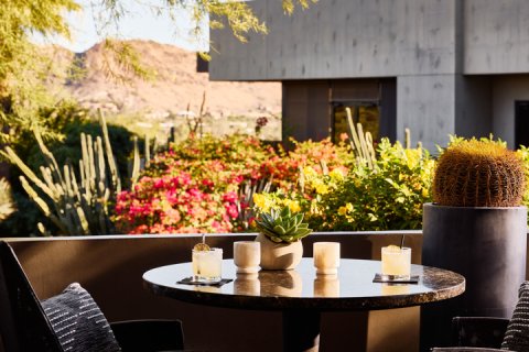 Jade bar patio table overlooking scenic views.