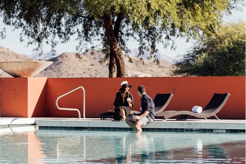 Couple enjoying a moment by the infinity pool.