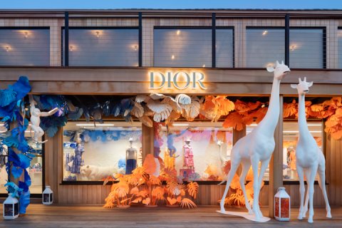 Dior pop-up shop storefront with seasonal decor.