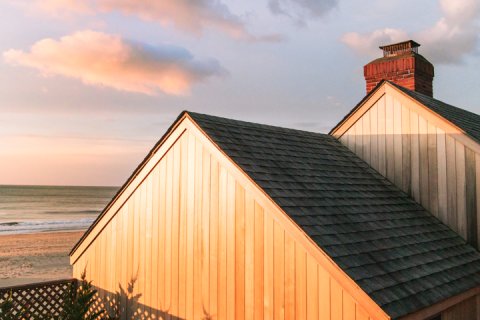 Shoreline of Gurney's Montauk Resort and Seawater Spa at sunset.